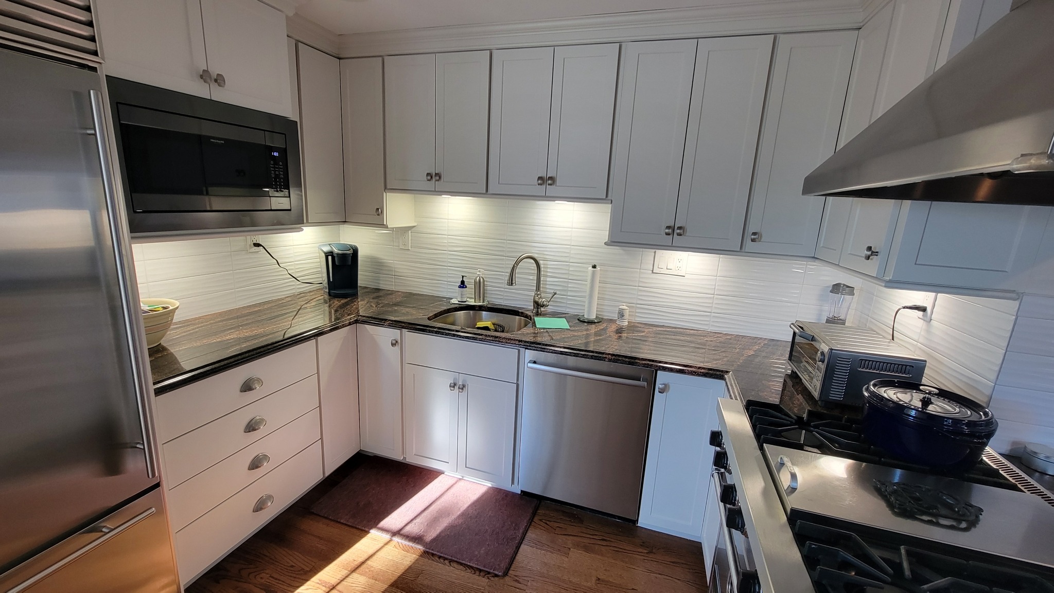 White cabinet refinishing by Heritage Coatings