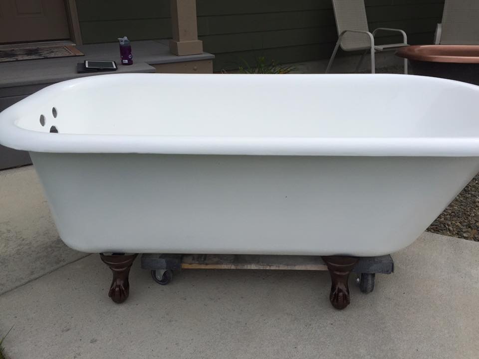 Refinished clawfoot tub with dark copper feet accent