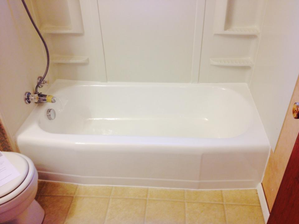 White bathtub with professional silicone caulking